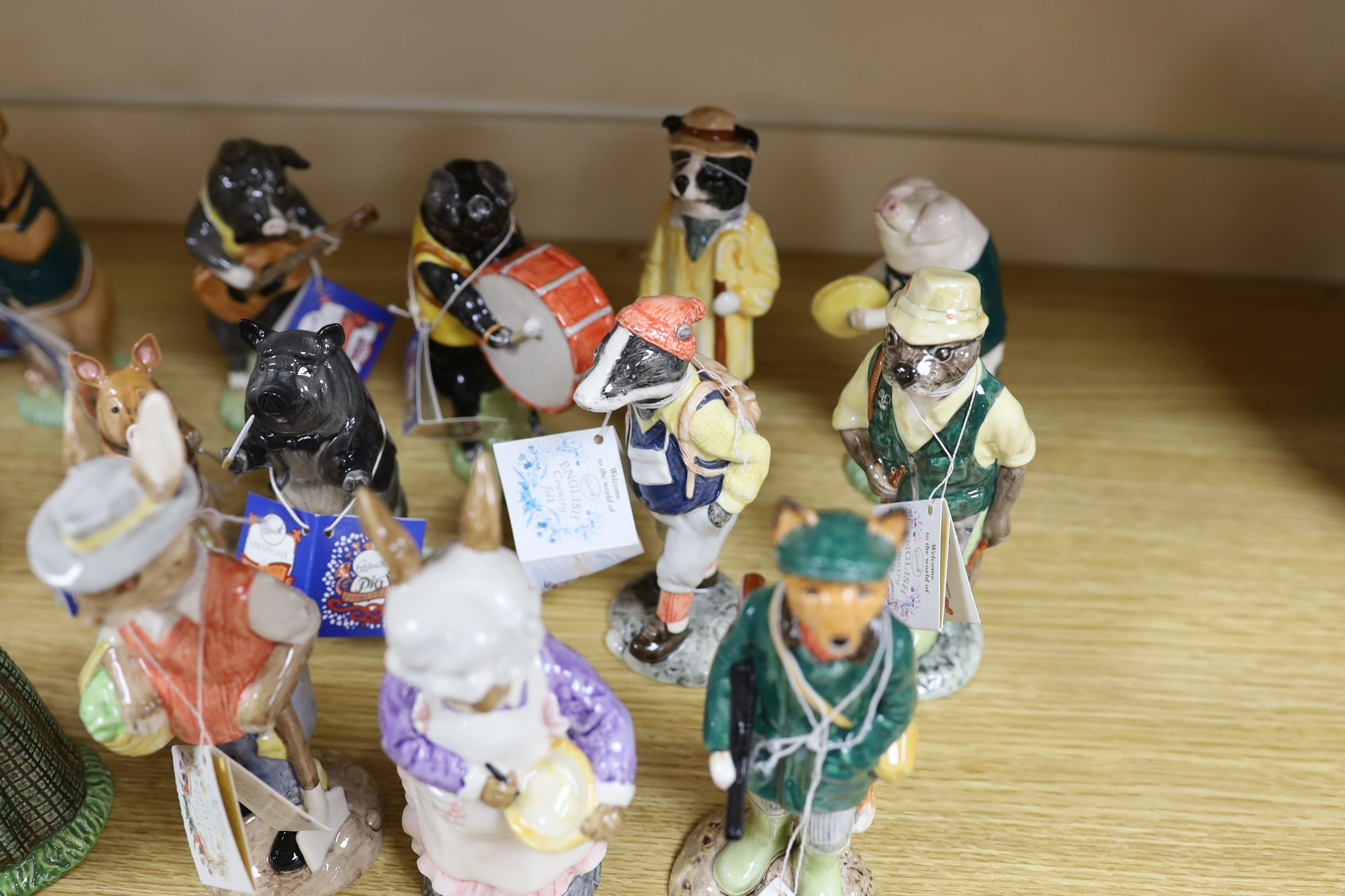 Eighteen Beswick figures, to include the Pig Promenade (10), and English Country Folk (8)